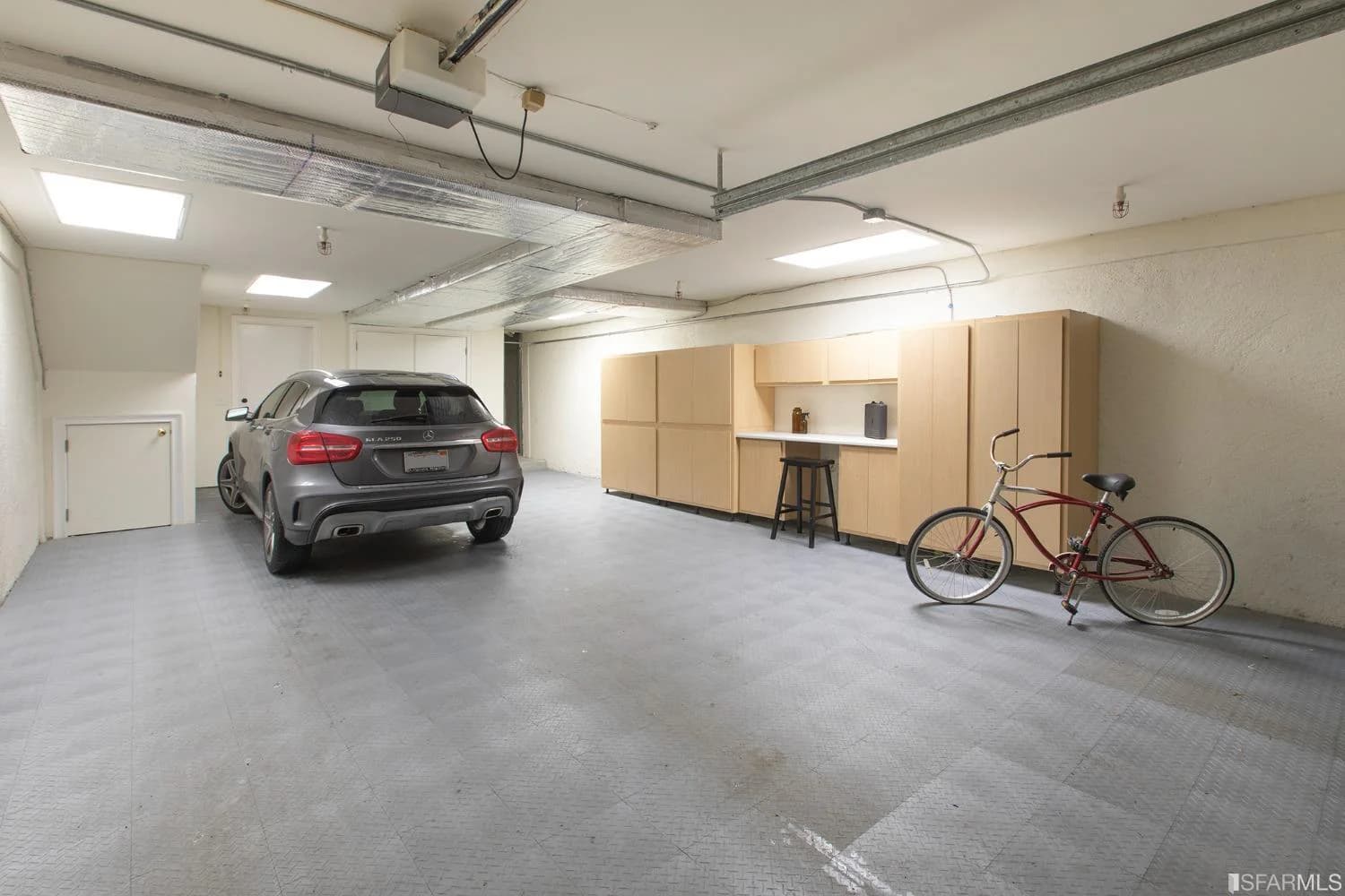 Interior-access two-car tandem garage with built-in storage