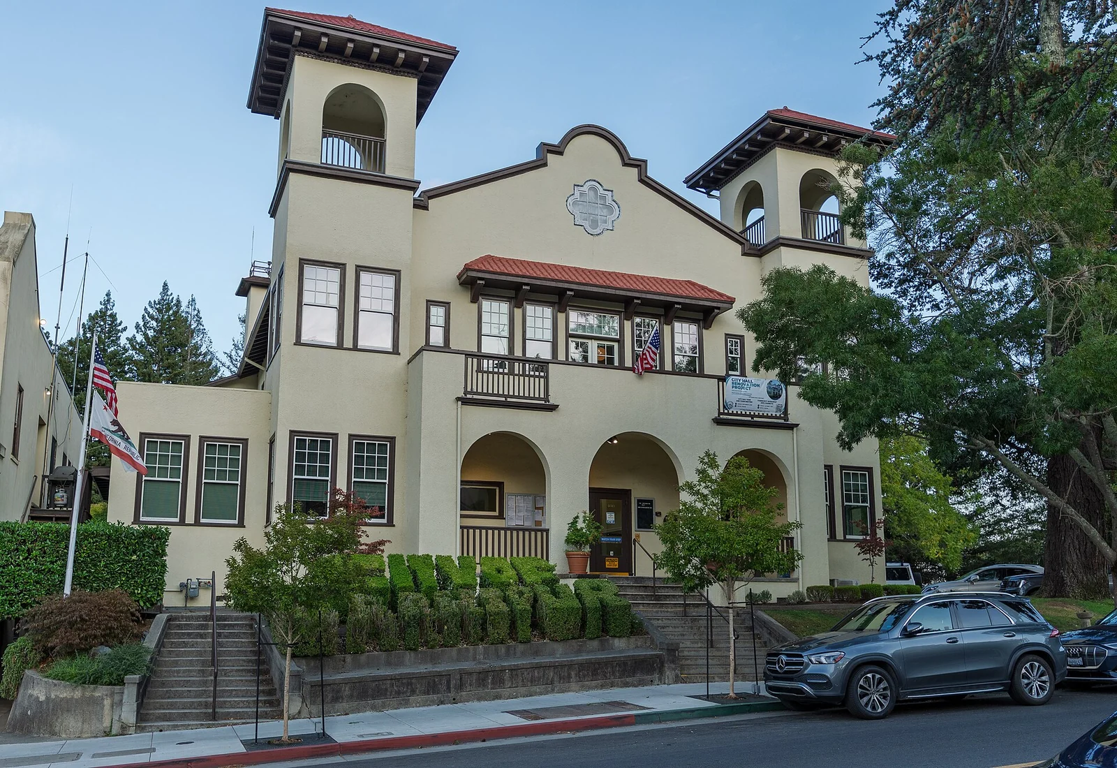 Larkspur City Hall on Magnolia Avenue, framed by street trees.